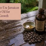 Jamaican castor oil bottle beside hair care items
